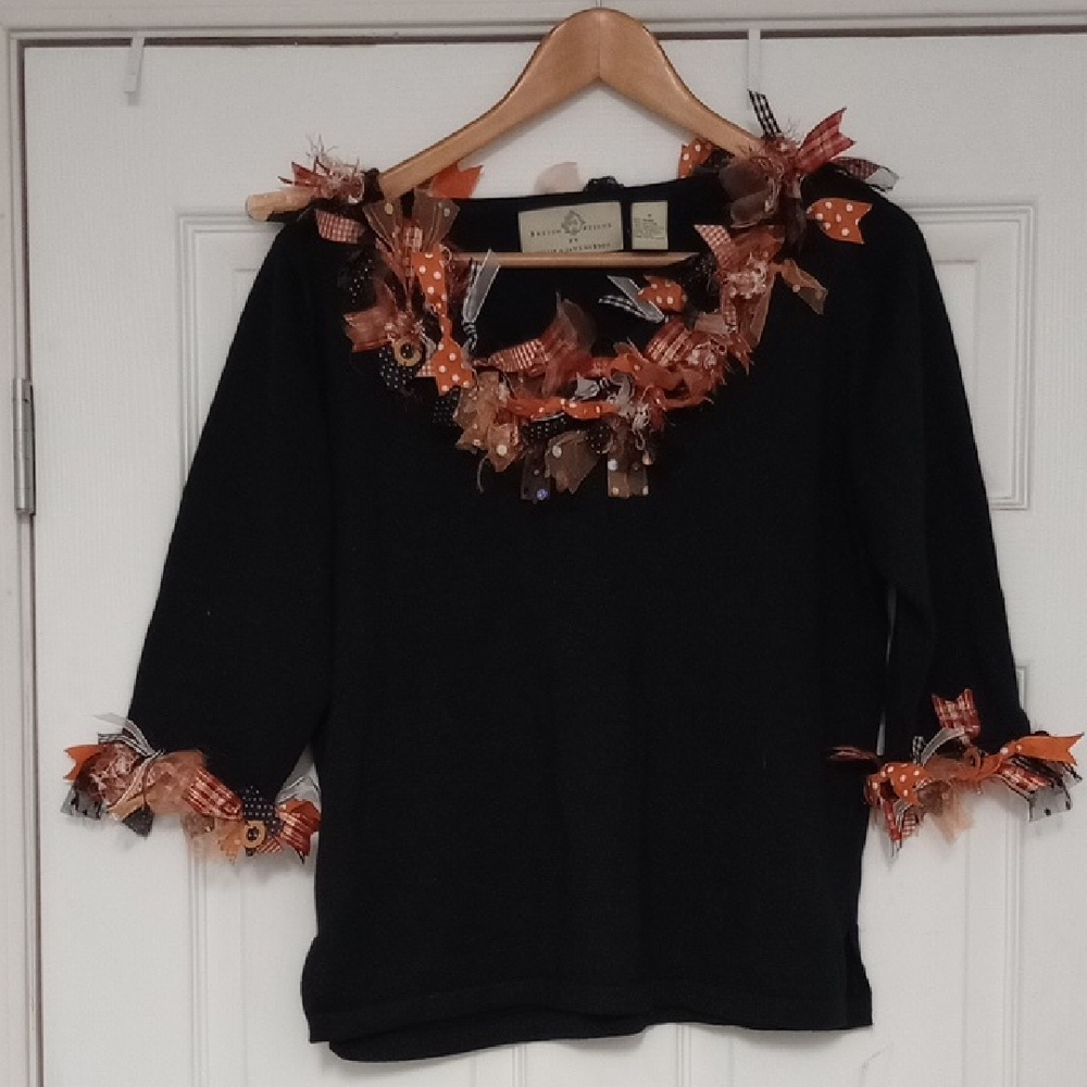 Elegant Black Sweater with Orange Details